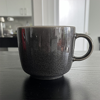 Complex geometry object 1: speckled grey mug, front view. 